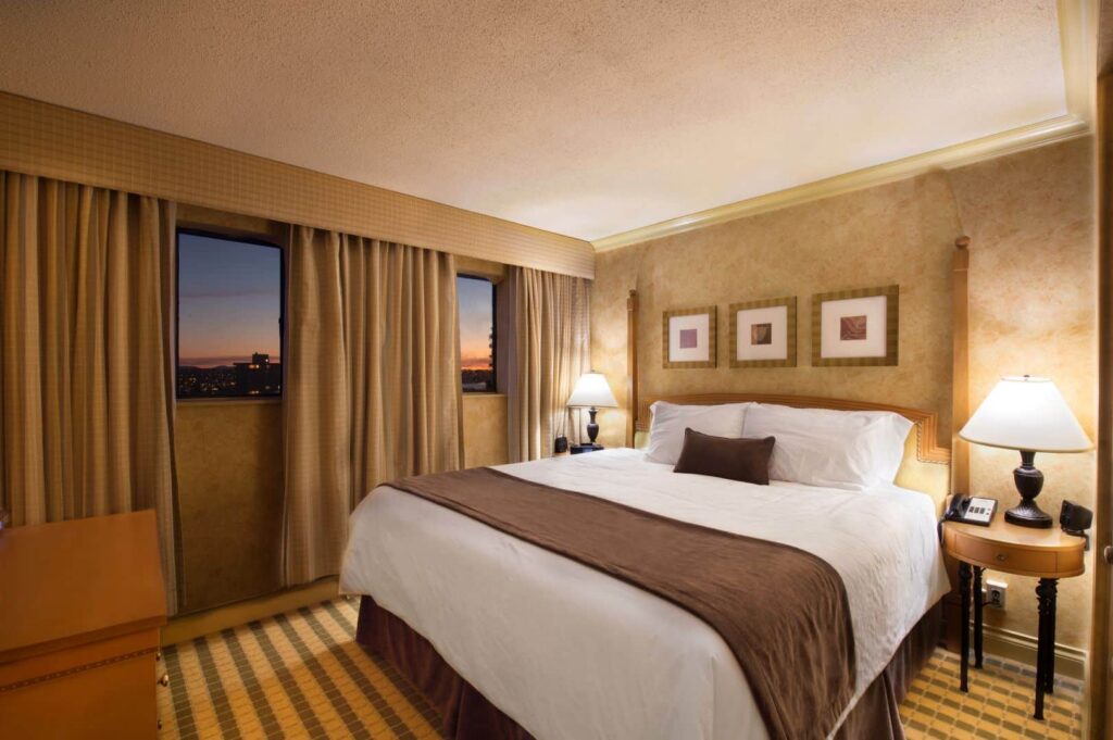 Sunset Inn and Suites Vancouver king suite bedrooom
