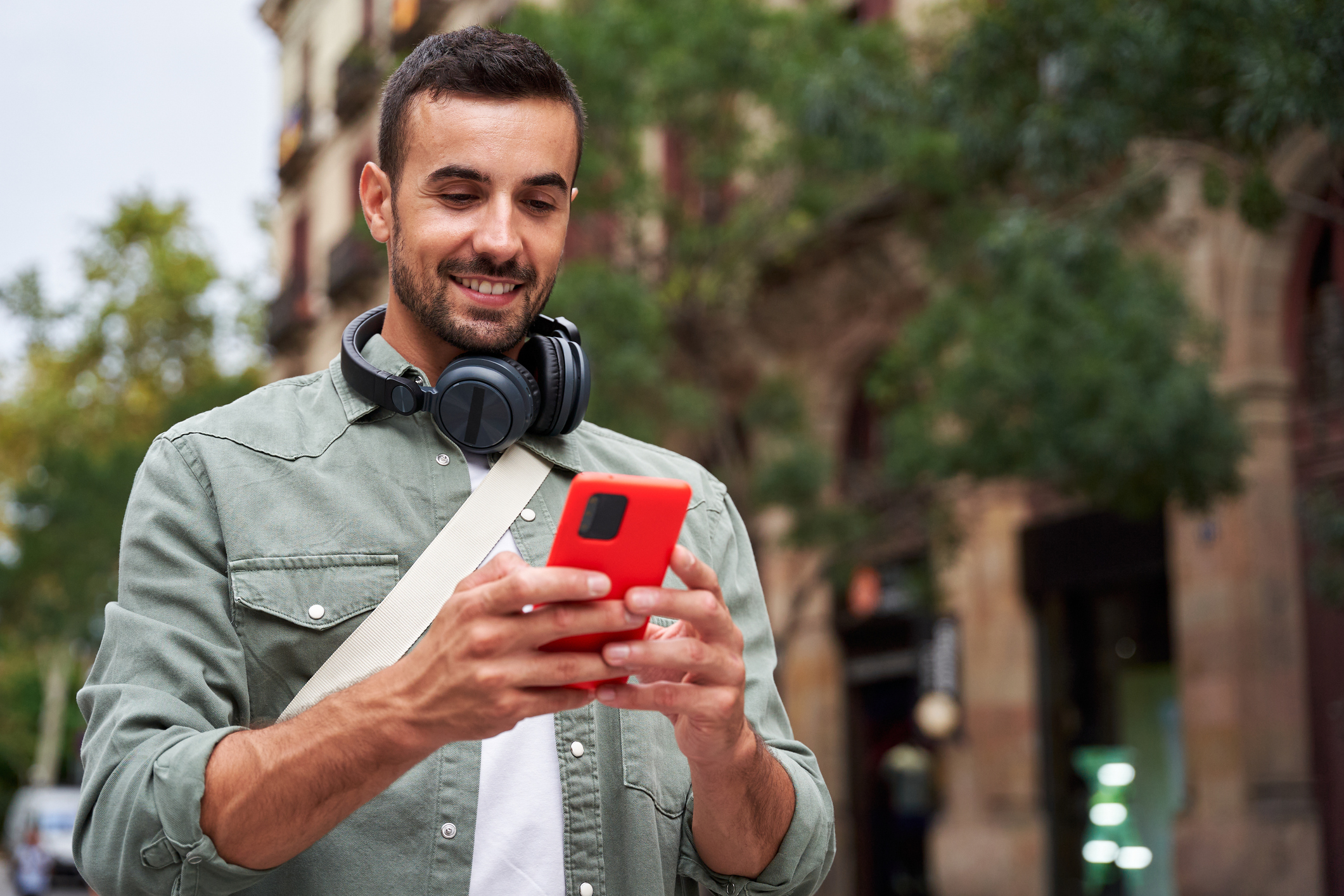 man happily scrolling social media